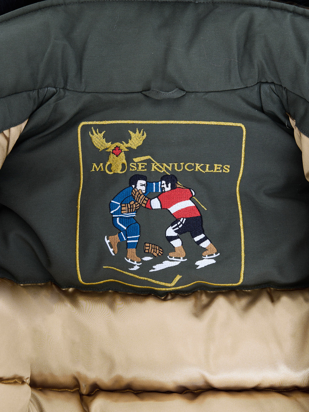 Giubbino Bomber Verde con Pompom Moose Knuckles